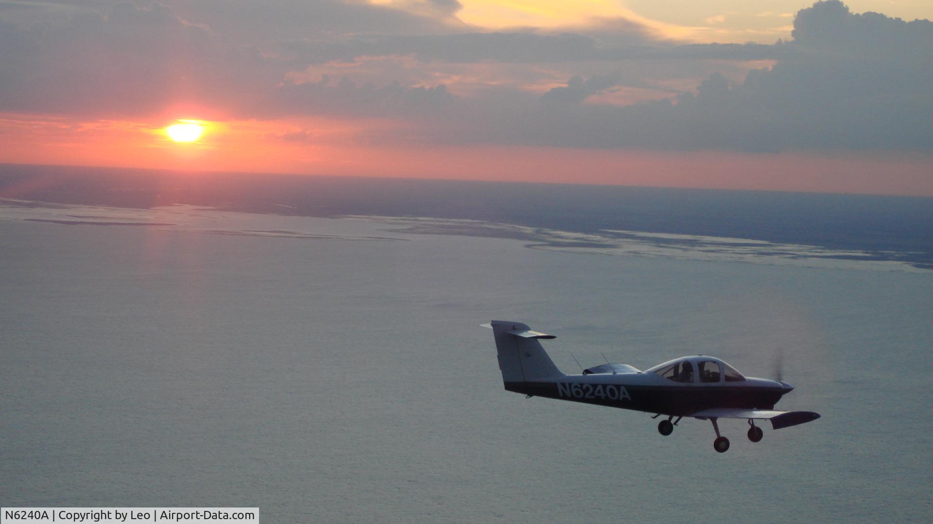 N6240A, 1978 Piper PA-38-112 Tomahawk Tomahawk C/N 38-78A0351, Sunset, Okeechobee Lake