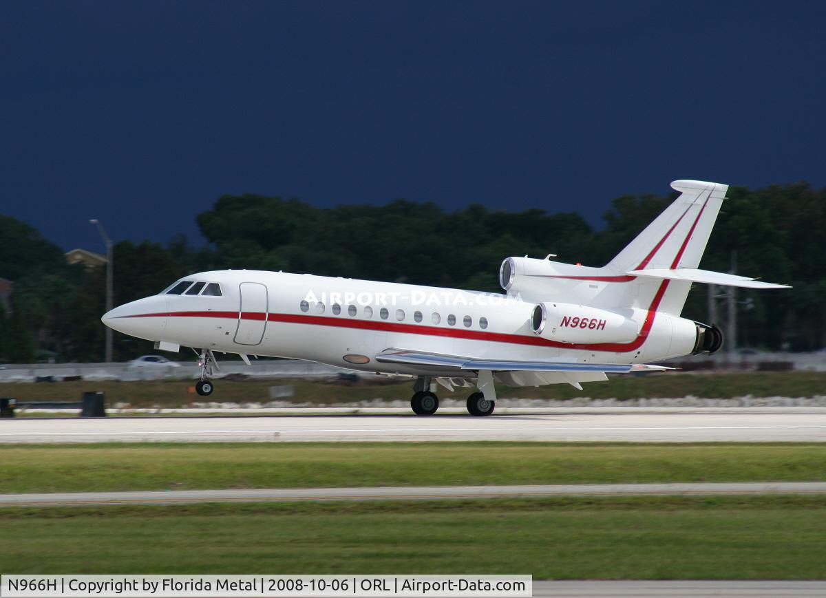 N966H, 2004 Dassault Falcon 900EX C/N 126, Falcon 900EX landing with storm in background