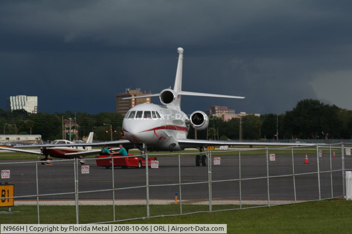 N966H, 2004 Dassault Falcon 900EX C/N 126, Falcon 900EX with storm in background