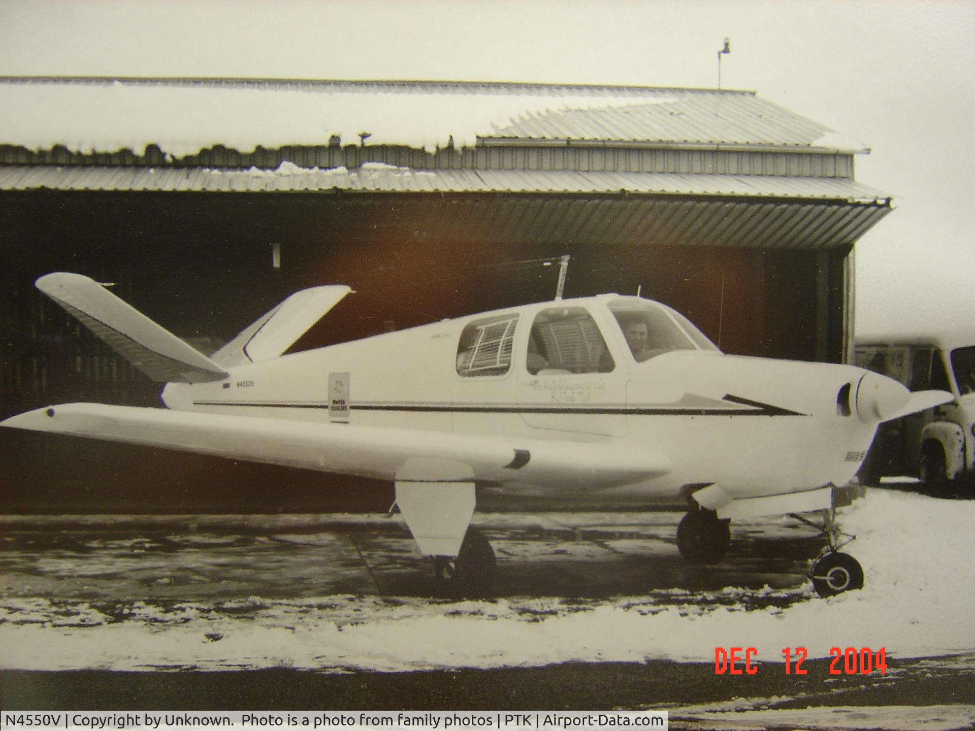 N4550V, 1948 Beech 35 Bonanza C/N D-1378, Taken in the 1950's in front of owner's and pilot's hanger. Taken before wing tip tanks wre installed. N number in small letters on tail.
