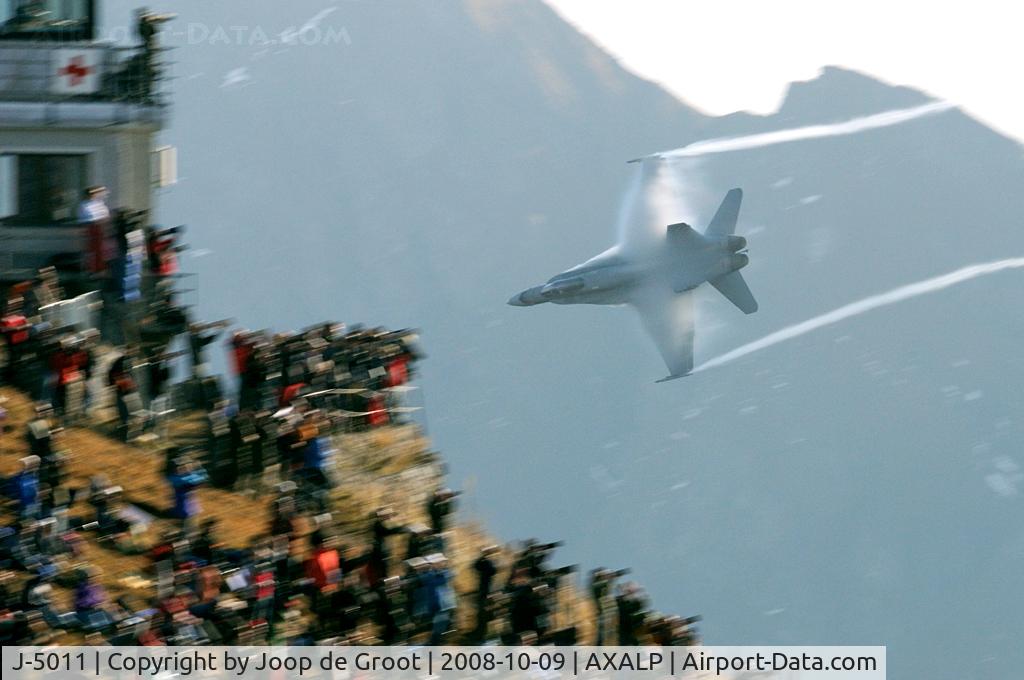 J-5011, McDonnell Douglas F/A-18C Hornet C/N 1351, After a strafing run on one of the targets this Hornet disappears behind the mountain. As you can see, we were not alone on the hill top.