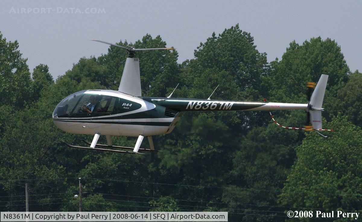 N8361M, 1996 Robinson R44 C/N 0303, Easing back down at Suffolk for another ride