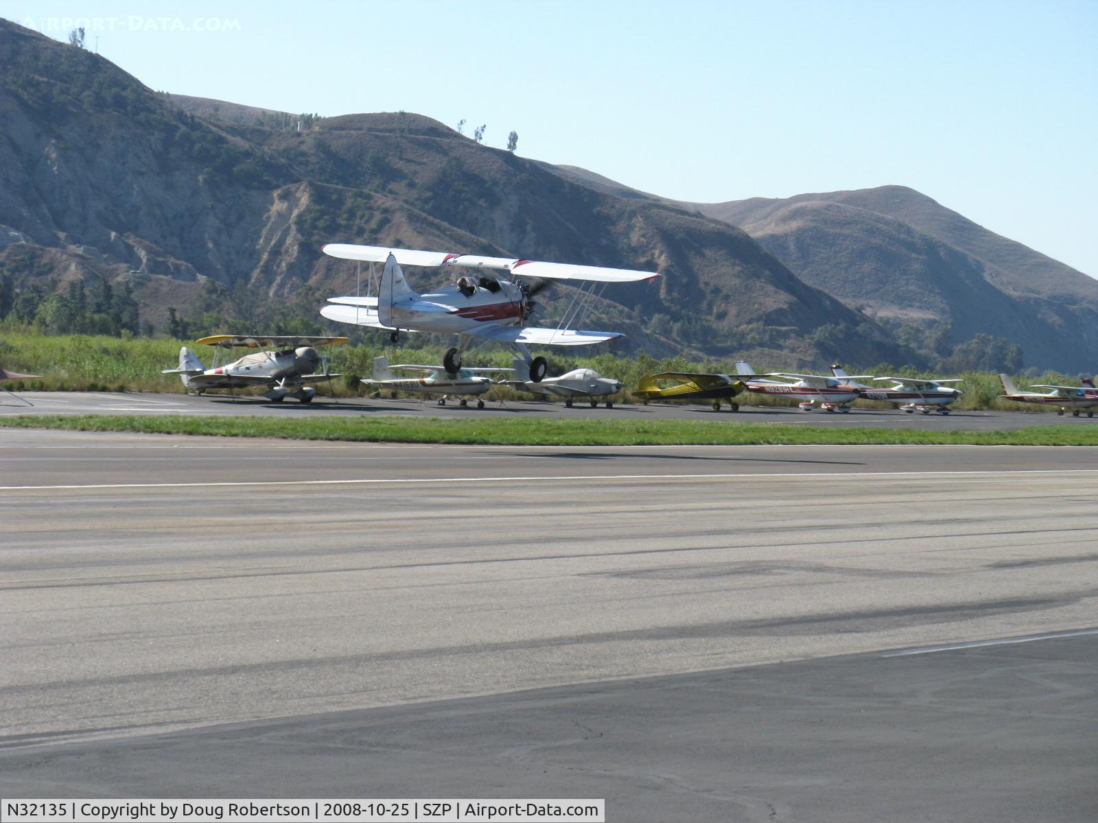N32135, 1941 Waco UPF-7 C/N 5767, 1941 Waco UPF-7, Continental W670 220 Hp, takeoff climb Rwy 22