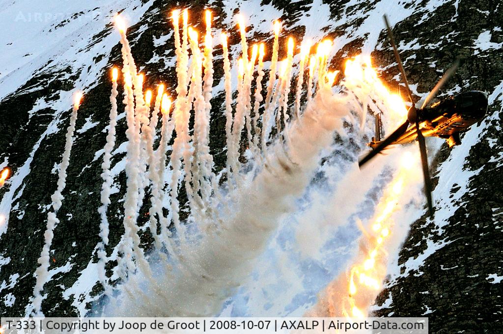 T-333, 2001 Eurocopter AS-532UL Cougar C/N 2521/MIS016, The 100+ flare launch by the Cougar TH98 still is one of the highlights of the anual Axalp demo.