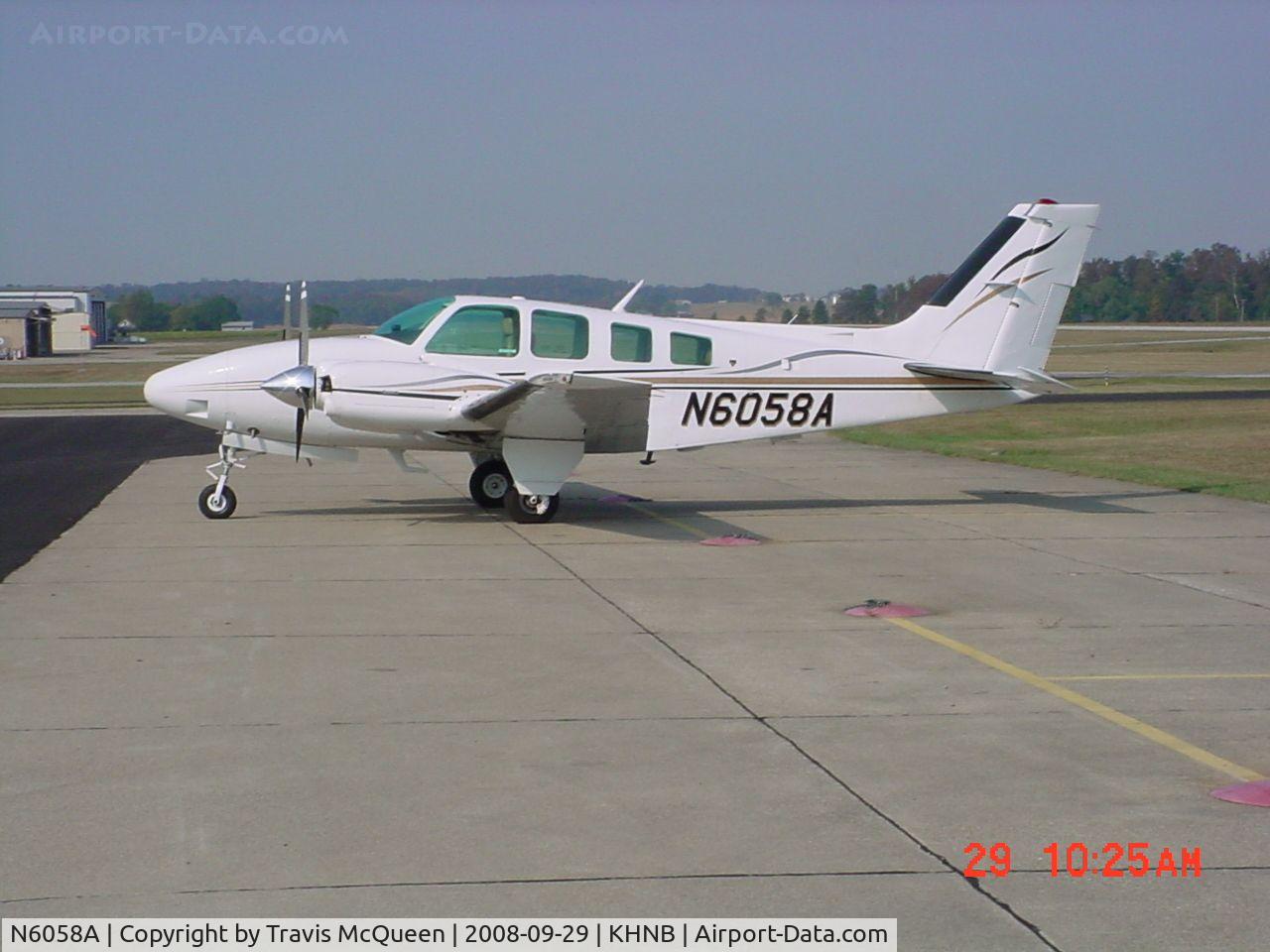 N6058A, 1979 Beech 58 Baron C/N TH-1017, Parked on ramp in front of Terminal... Looking West...
