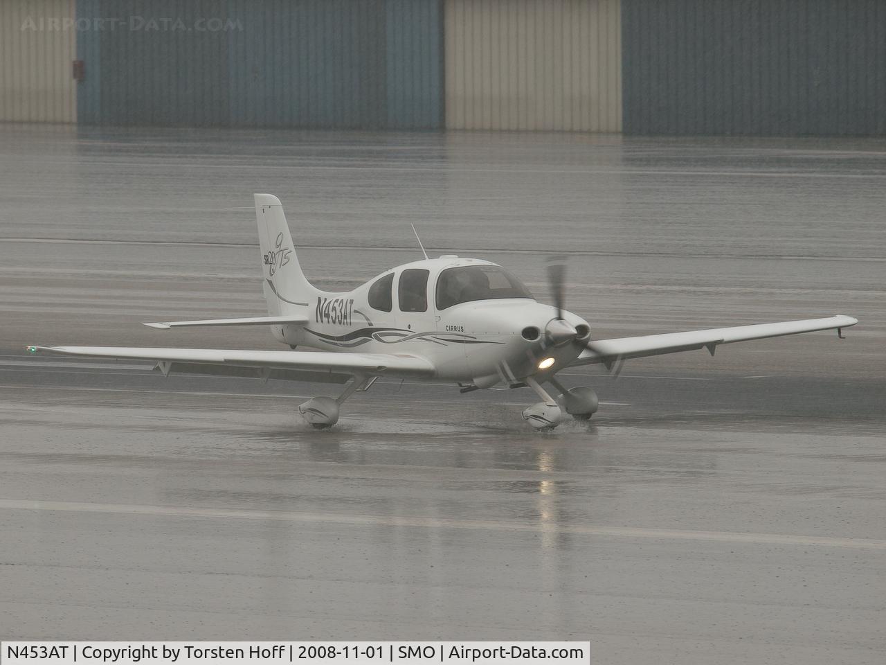 N453AT, 2006 Cirrus SR20 GTS C/N 1756, N453AT arriving on RWY 03 during a heavy downpour