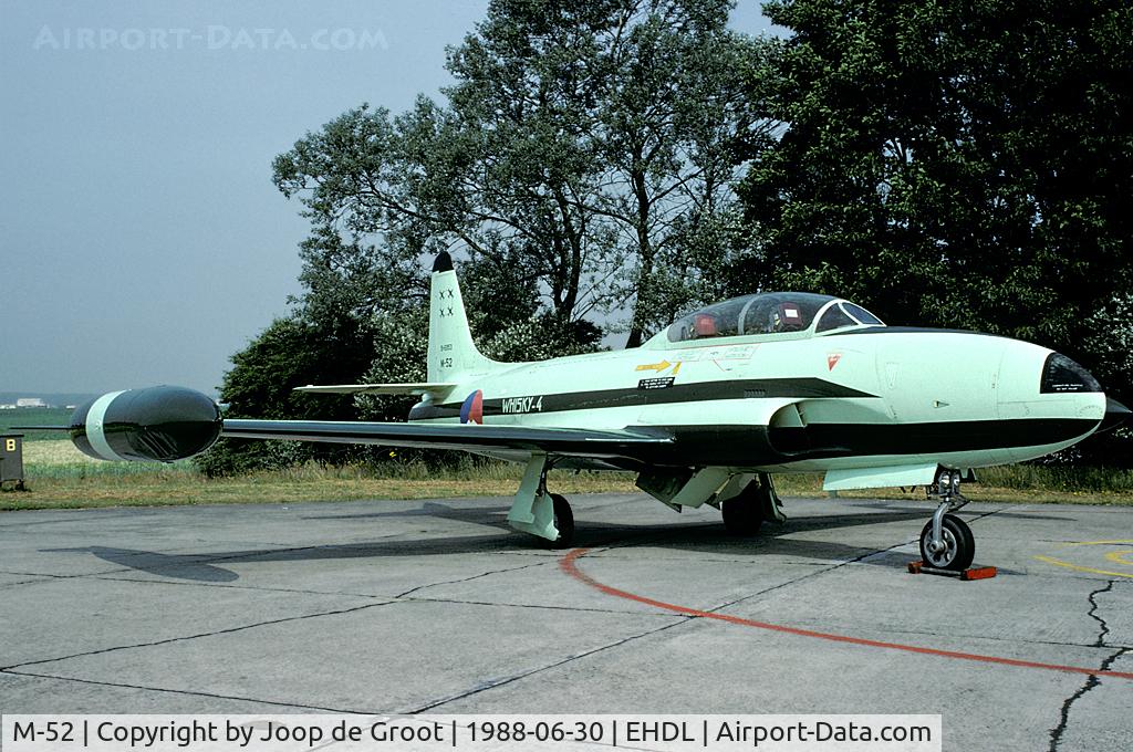 M-52, 1952 Lockheed T-33A Shooting Star C/N 580-6285, In the colors of the Whiskey-4 display team. After the Deelen Air Show the aircraft was moved to Woensdrecht as a gate guard. Although showing serial number M-52 this aircraft in fact was M-54 in Dutch service. As a gate guard it is presented as M-51.