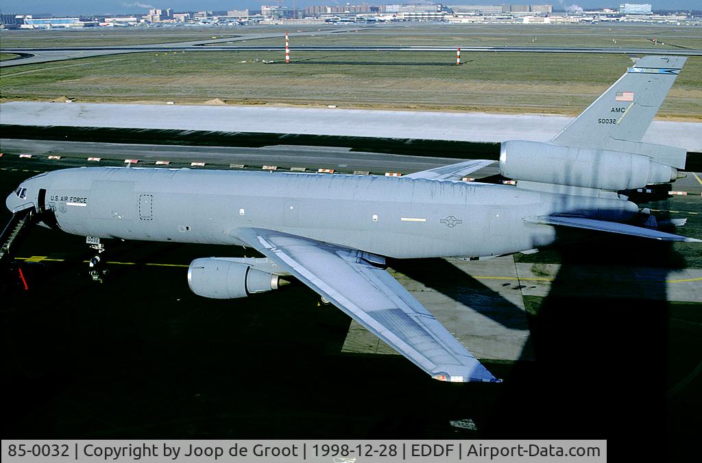 85-0032, 1985 McDonnell Douglas KC-10A Extender C/N 48237, 32 AS/305 AMW. On this very cold winters day it was freezing cold on top of the control tower. The ice on top of fuselage is just melting away. The civil terminal is of the far side.