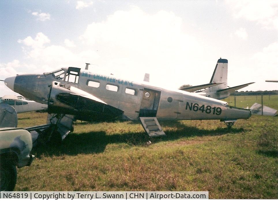 N64819, 1943 Beech RC-45J Expeditor C/N 5834, Setting in the grass in Wauchula, FL..
