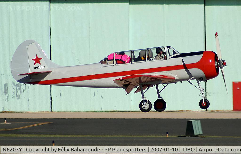 N6203Y, 1985 Yakovlev (Aerostar) Yak-52 C/N 855510, Landing at TJBQ.