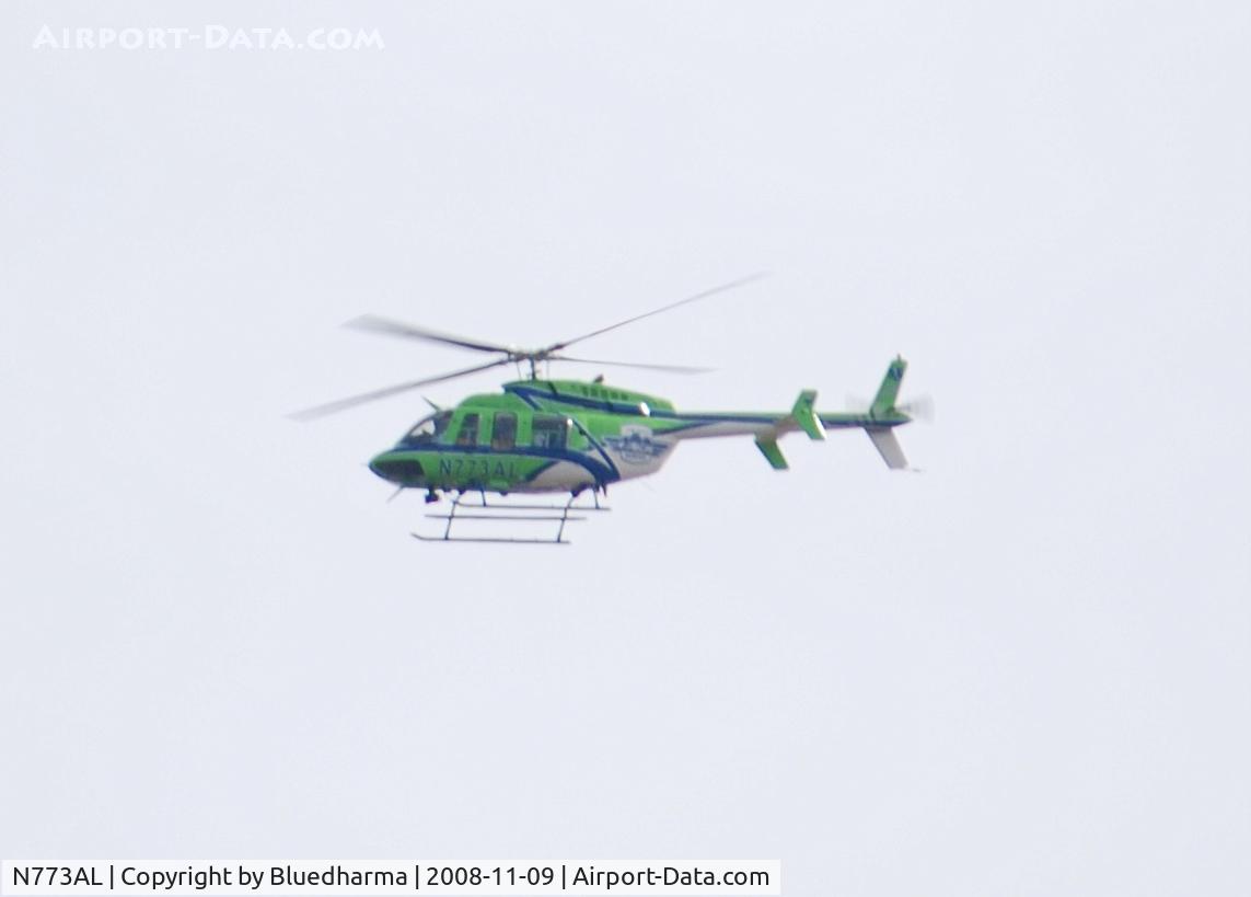 N773AL, 1997 Bell 407 C/N 53160, Airlife of Denver Flying North over Columbine High School, Littleton Colorado