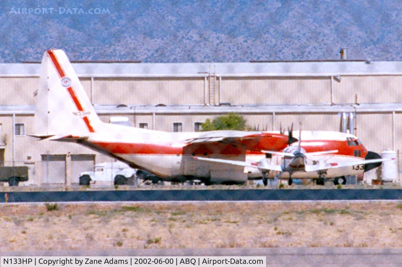 N133HP, 1989 Lockheed C-130A Hercules C/N 182-3189, At Albuquerque (Sorry about shooting through the fence it was too high to see over)