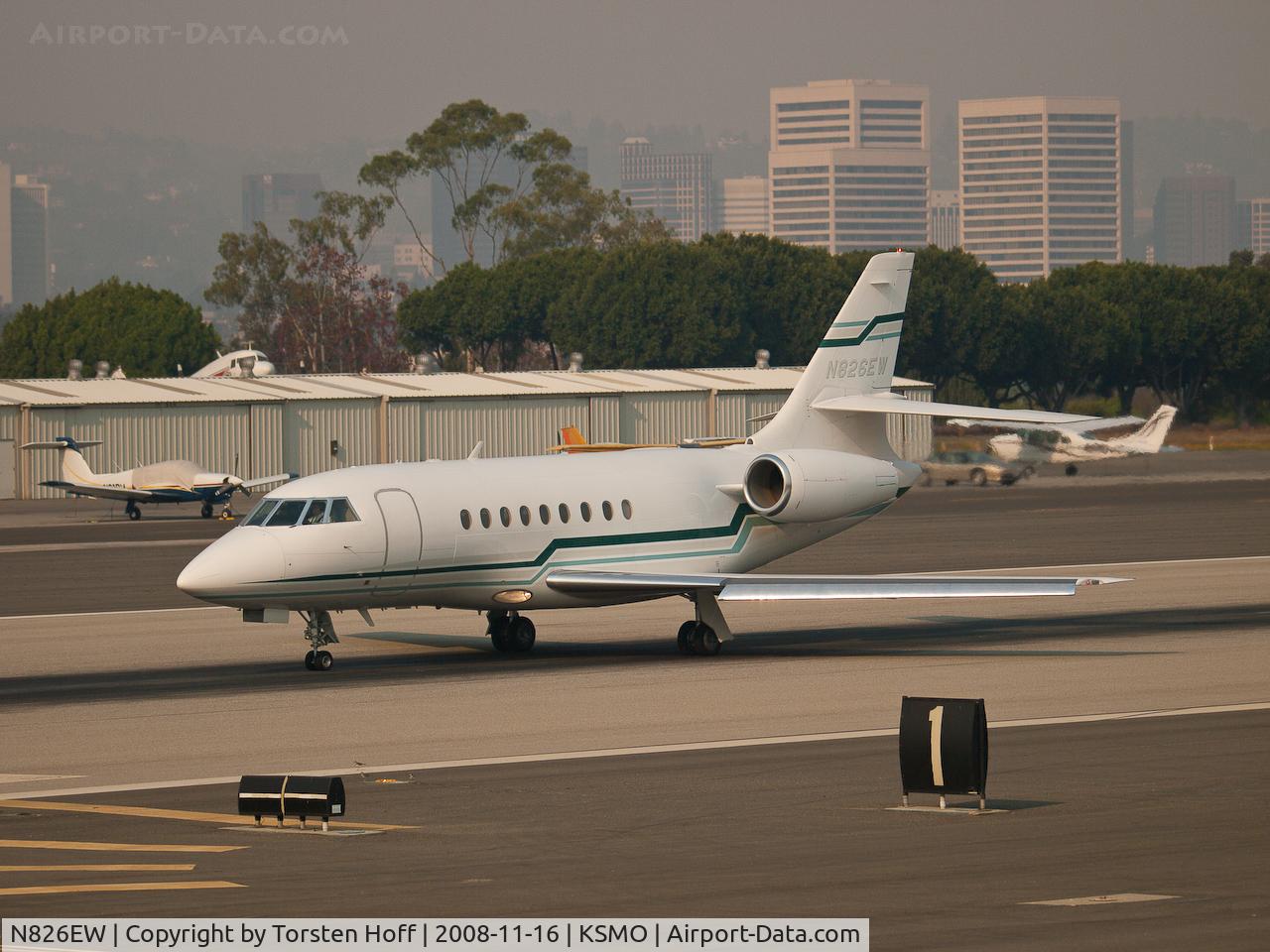 N826EW, 1998 Dassault Falcon 2000 C/N 58, N826EW departing from RWY 21 into a sky thick with smoke from wildfires.