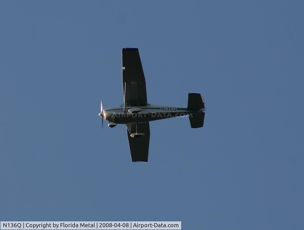 N136Q, 1959 Cessna 182B Skylane C/N 52163, Classic Cessna 182 in holding pattern over Lake Parker on way to Sun N Fun
