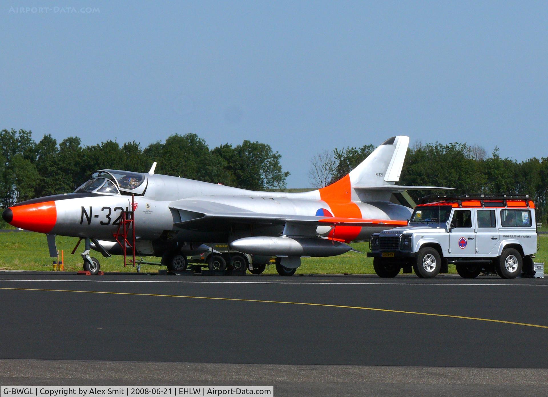 G-BWGL, 1959 Hawker Hunter T.8C C/N 41H/695946, Hawker Hunter T8C G-BWGL painted as Dutch Air Force N-321 parked next to the other boyztoy