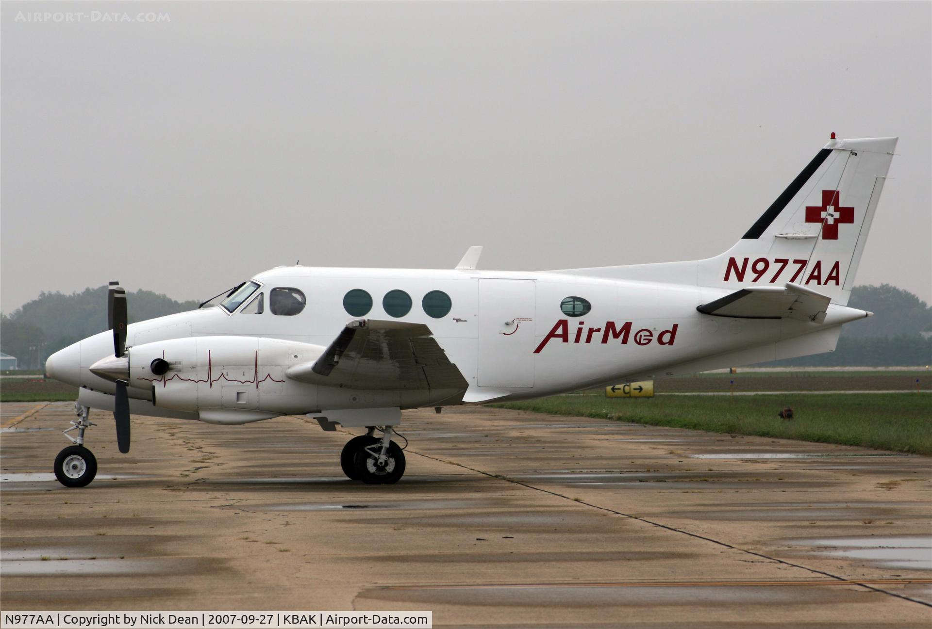 N977AA, 1972 Beech C90 King Air C/N LJ-555, Obviously a below average picture of a King Air on a ramp in the midwest
