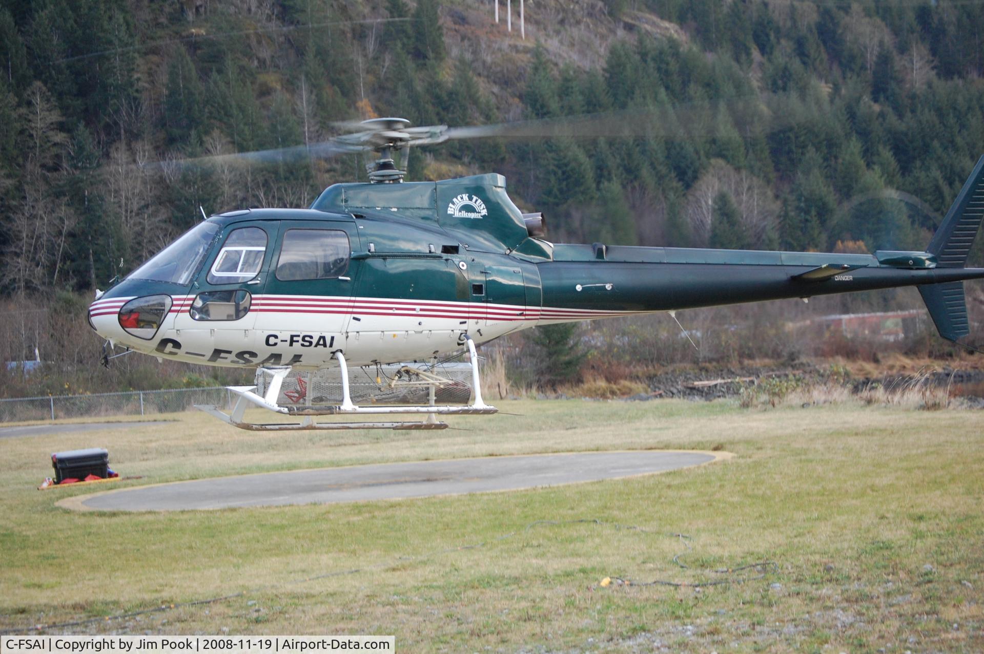 C-FSAI, 1989 Aerospatiale AS-350B Ecureuil C/N 2176, C-FSAI lifting off from Heliport at Tahsis, BC Canada