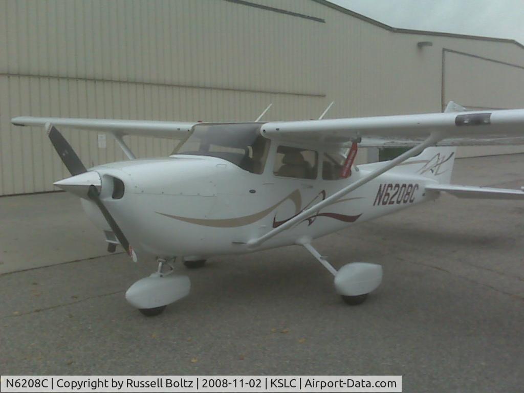 N6208C, 2008 Cessna 172S C/N 172S10820, Parked in front of the hanger