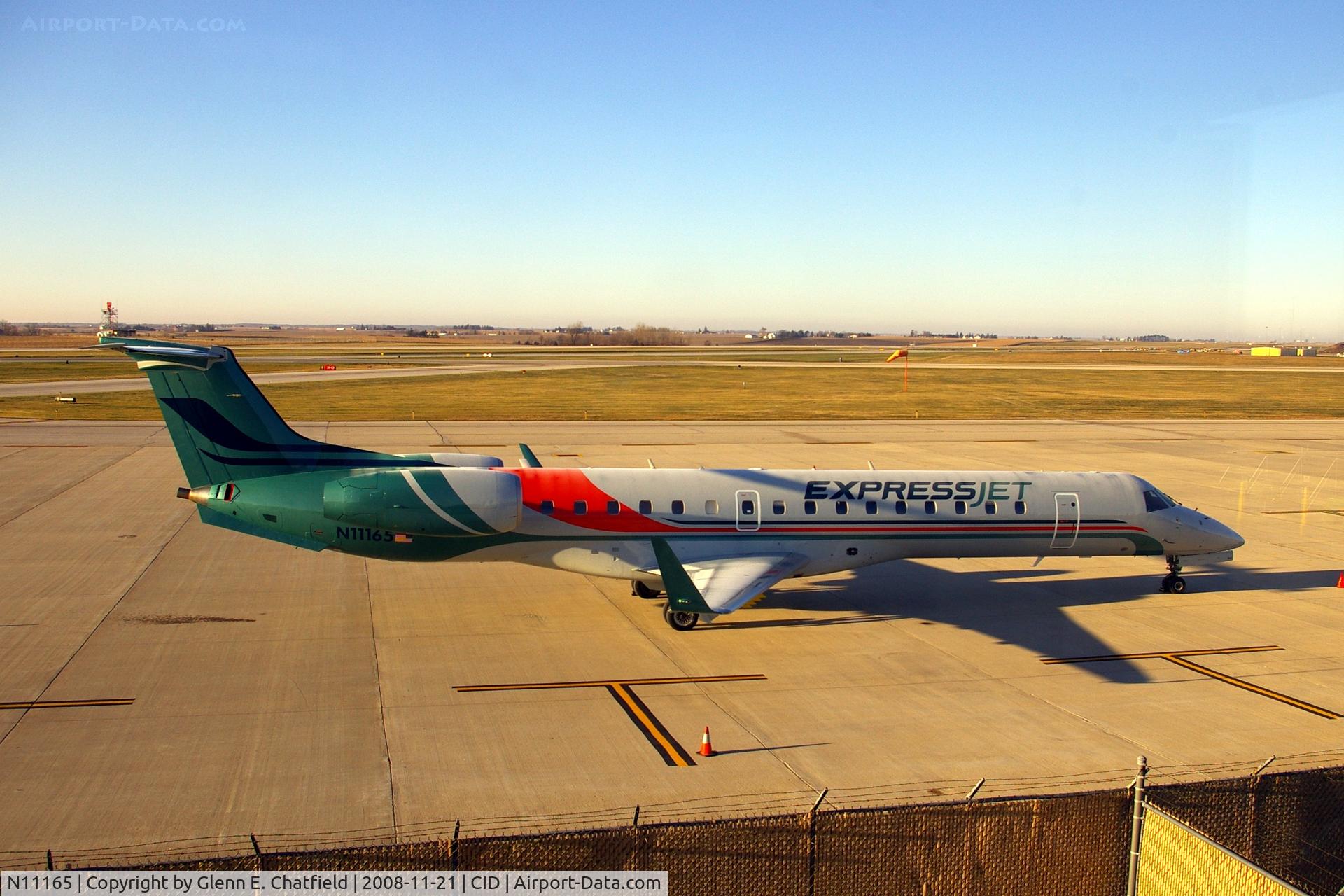 N11165, 2004 Embraer ERJ-145XR (EMB-145XR) C/N 14500819, Parked in front of the control tower