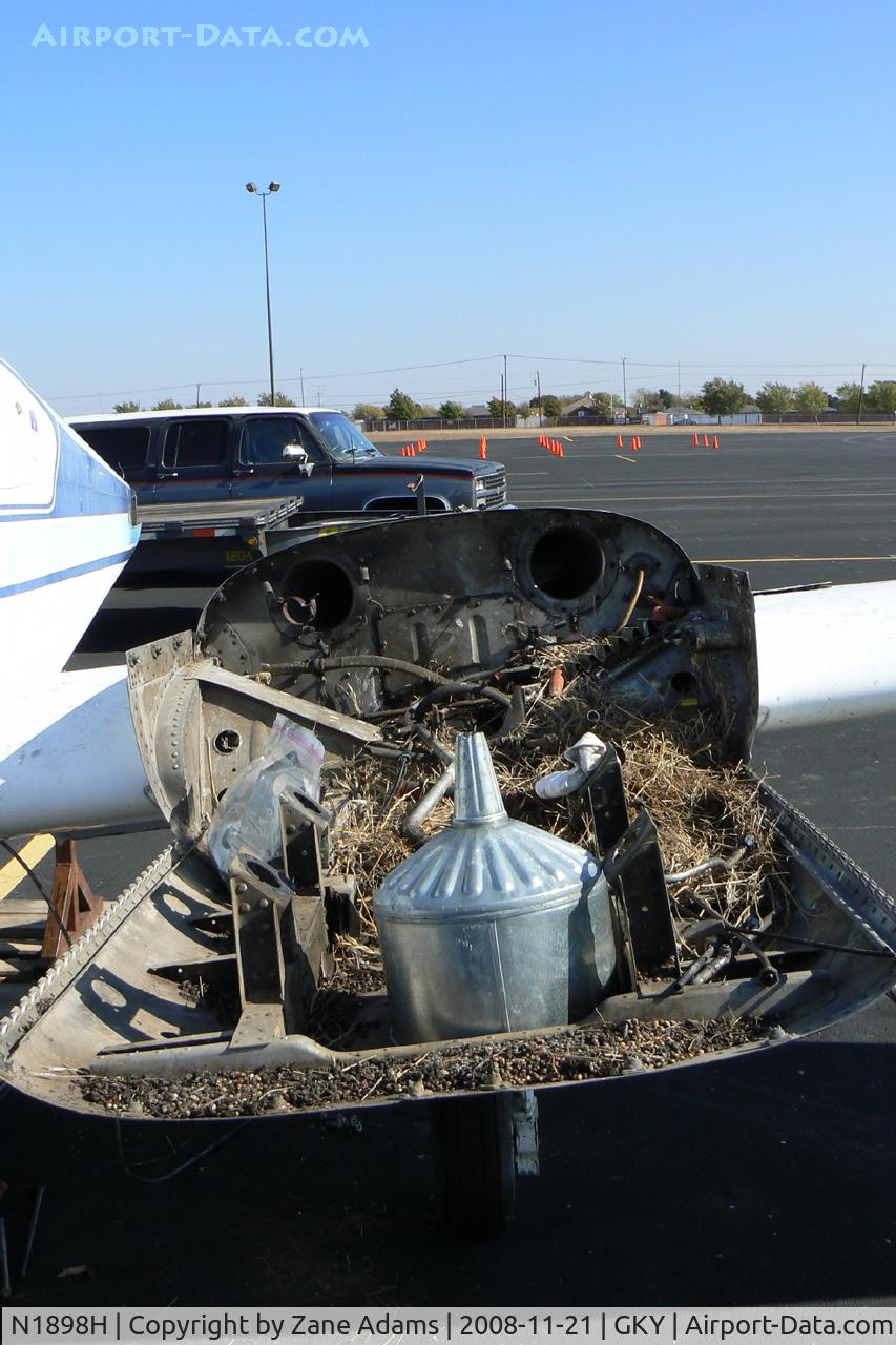 N1898H, 1959 Cessna 310C C/N 35998, At Arlington Municipal - This Cessna 310 has been sitting on the ramp for at least 10 years. The owner passed away several years ago and the airplane became a bird nest. It was taken to the graveyard last week. It's always hard to see an airplane die.