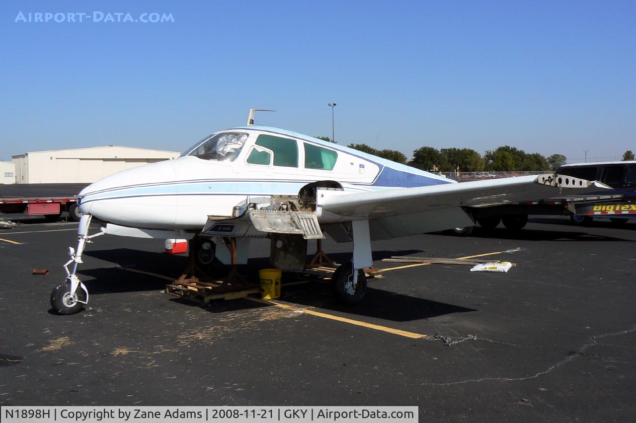 N1898H, 1959 Cessna 310C C/N 35998, At Arlington Municipal - This Cessna 310 has been sitting on the ramp for at least 10 years. The owner passed away several years ago and the airplane became a bird nest. It was taken to the graveyard last week. It's always hard to see an airplane die.