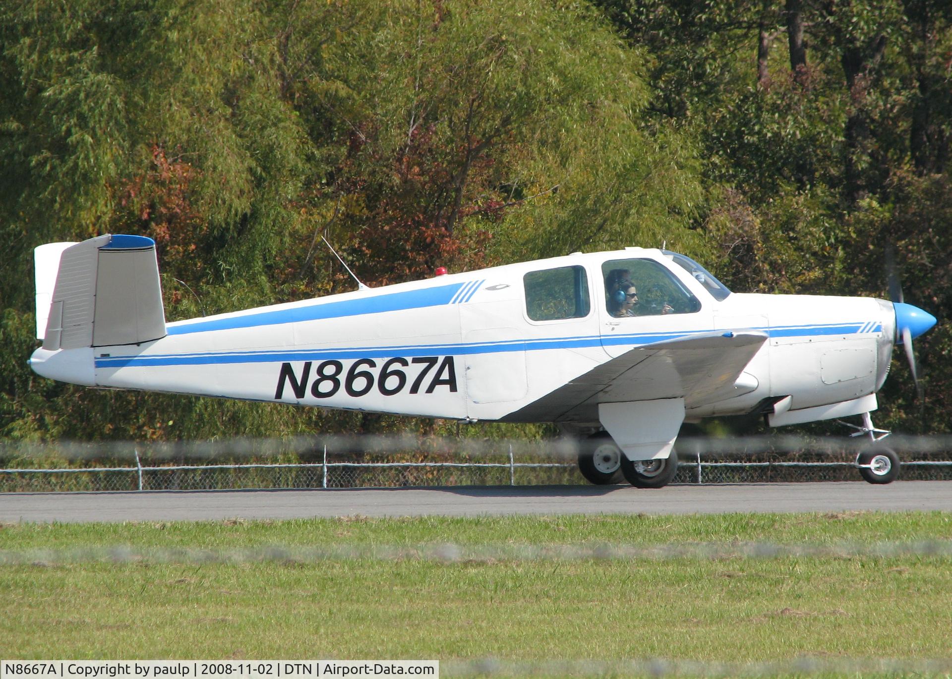 N8667A, Beech A35 Bonanza C/N D2129, Taking off from Downtown Shreveport.