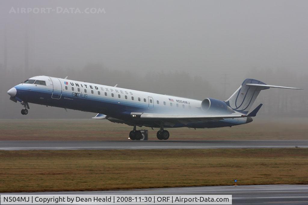 N504MJ, 2002 Bombardier CRJ-700 (CL-600-2C10) Regional Jet C/N 10066, United Express (operated by Mesa Airlines) N504MJ (FLT ASH7194) departing RWY 5 on a very foggy/rainy afternoon in Norfolk, VA enroute to Washington Dulles Int'l (KIAD).