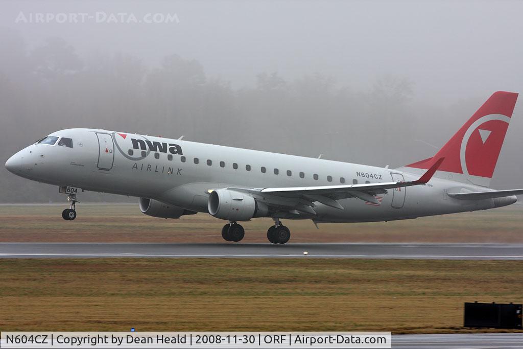 N604CZ, 2007 Embraer 175LR (ERJ-170-200LR) C/N 17000181, NWA Airlink (Compass Airlines) N604CZ (FLT CPZ1957) departing RWY 5 on a foggy/rainy afternoon in Norfolk, VA enroute to Detroit Metro Wayne County (KDTW).