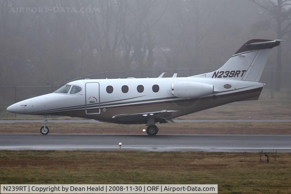 N239RT, Raytheon Aircraft Company 390 C/N RB-139, Sunset Aviation Inc Raytheon 390 Premiere I N239RT (FLT TWY239) rolling out on RWY 5 after arrival from Morgantown Municipal (KMGW) on a foggy/rainy afternoon in Norfolk, VA. The tower could not see the aircraft on the ground due to the fog.