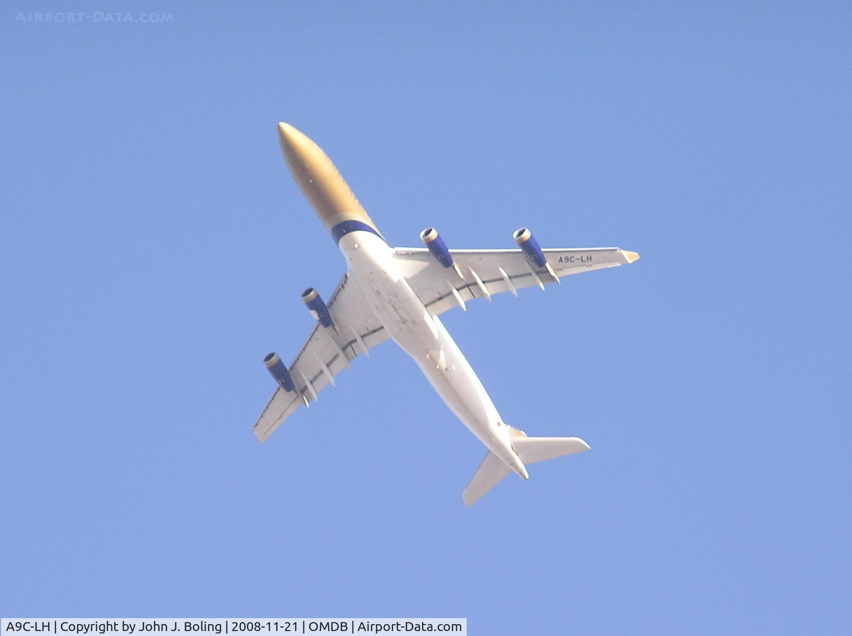 A9C-LH, 1998 Airbus A340-313X C/N 215, Bahrain reg A340 departing Dubai OMDB/DXB. Shot from hotel pool.