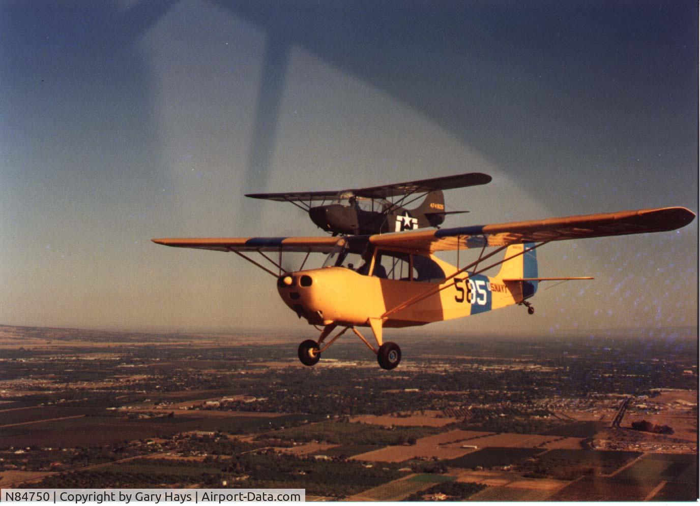 N84750, 1946 Aeronca 7AC Champion C/N 7AC-3469, N84750 in the foreground, 1990, Yuba City, CA.