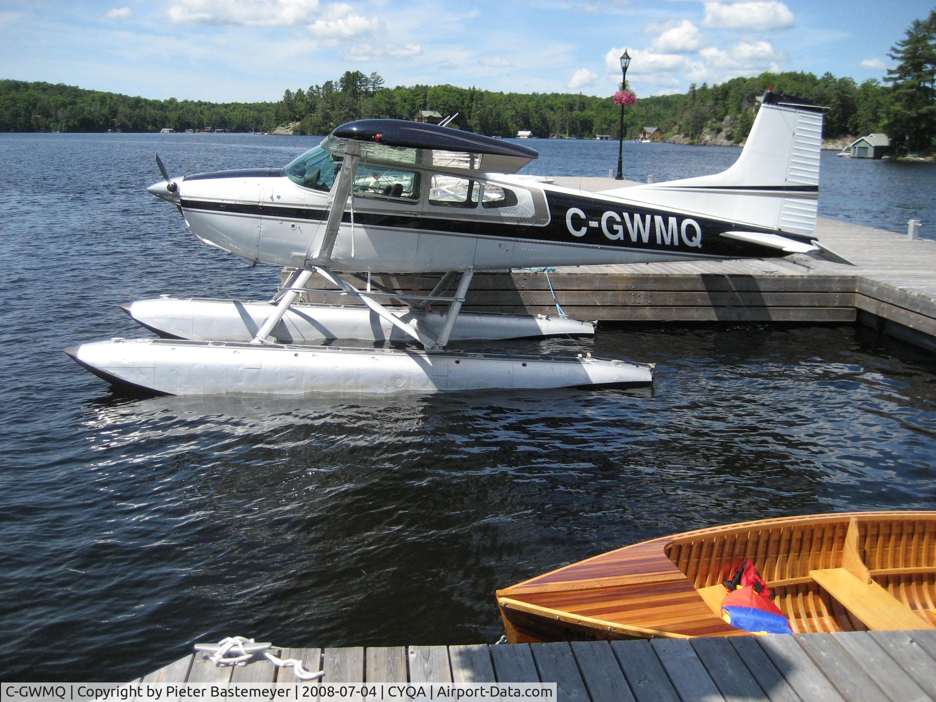 C-GWMQ, 1975 Cessna 180J C/N 180-52564, Sunny day in July, at the docks of the village of Rosseau, ON