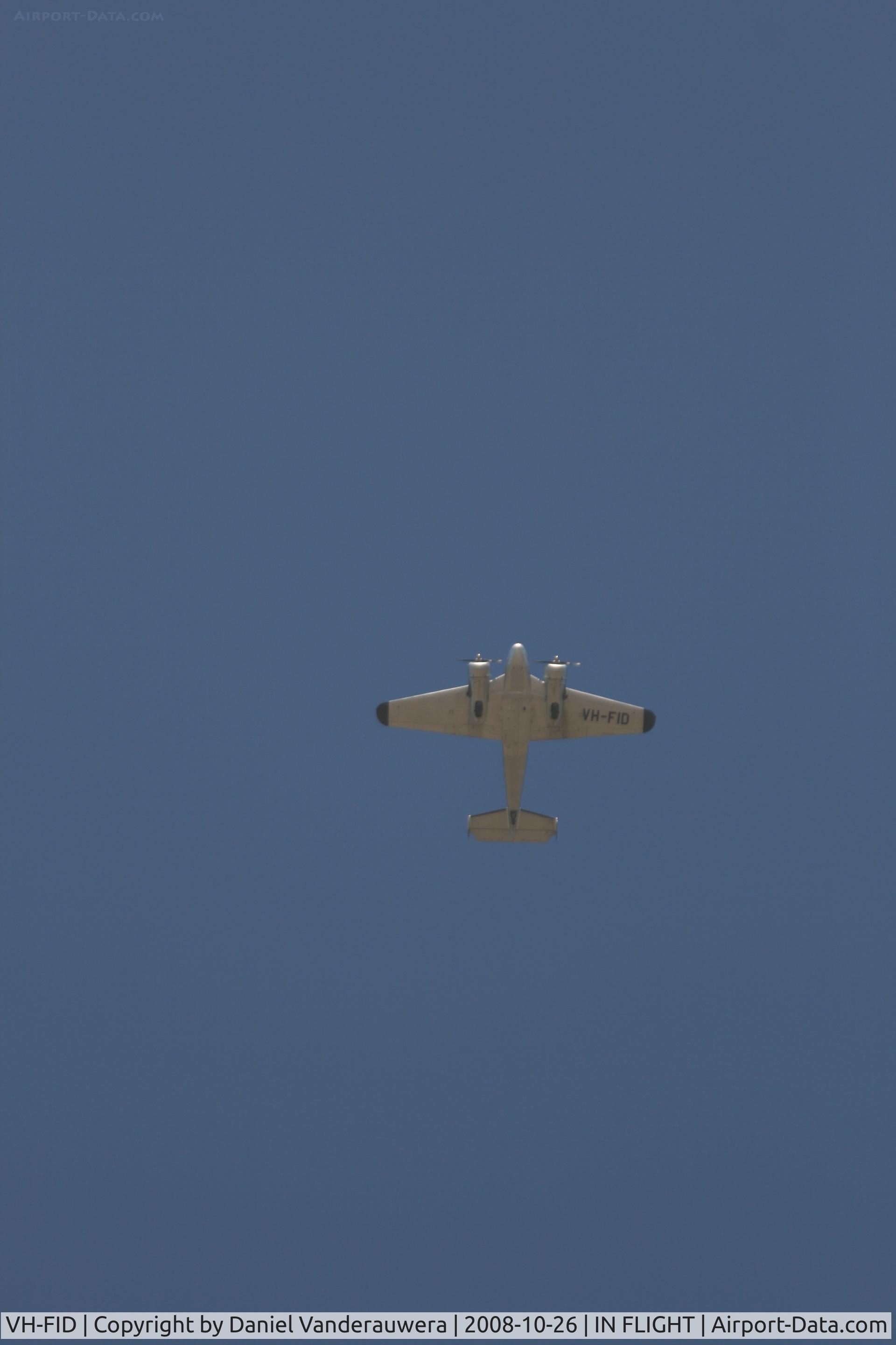 VH-FID, 1948 Beech D18-S C/N A-458, Vintage aircraft flying over HMAS SYDNEY Memorial - Geraldton WA