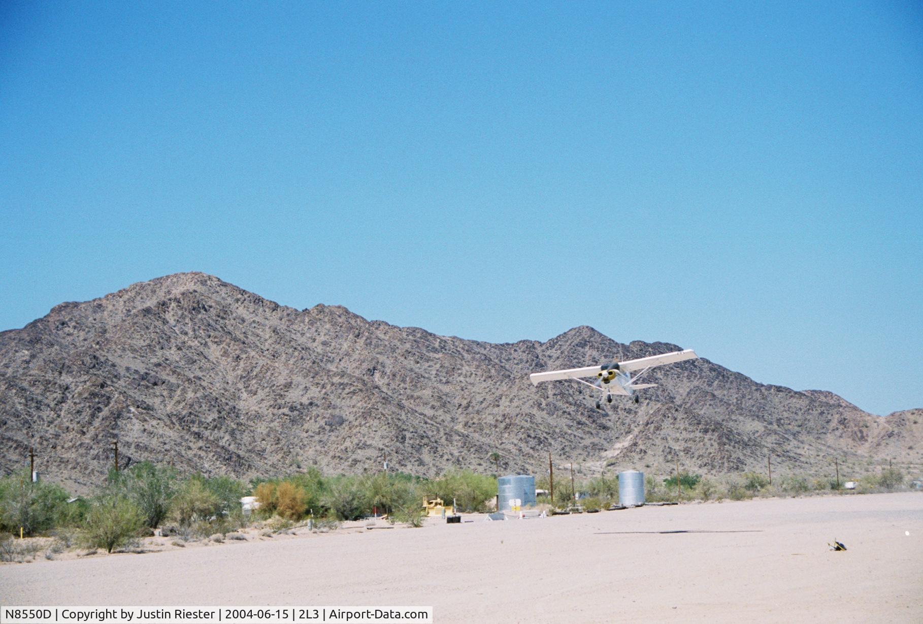N8550D, 1957 Piper PA-22-160 Tri Pacer C/N 22-5782, Lifting off from WASP field in Quartzite, AZ.