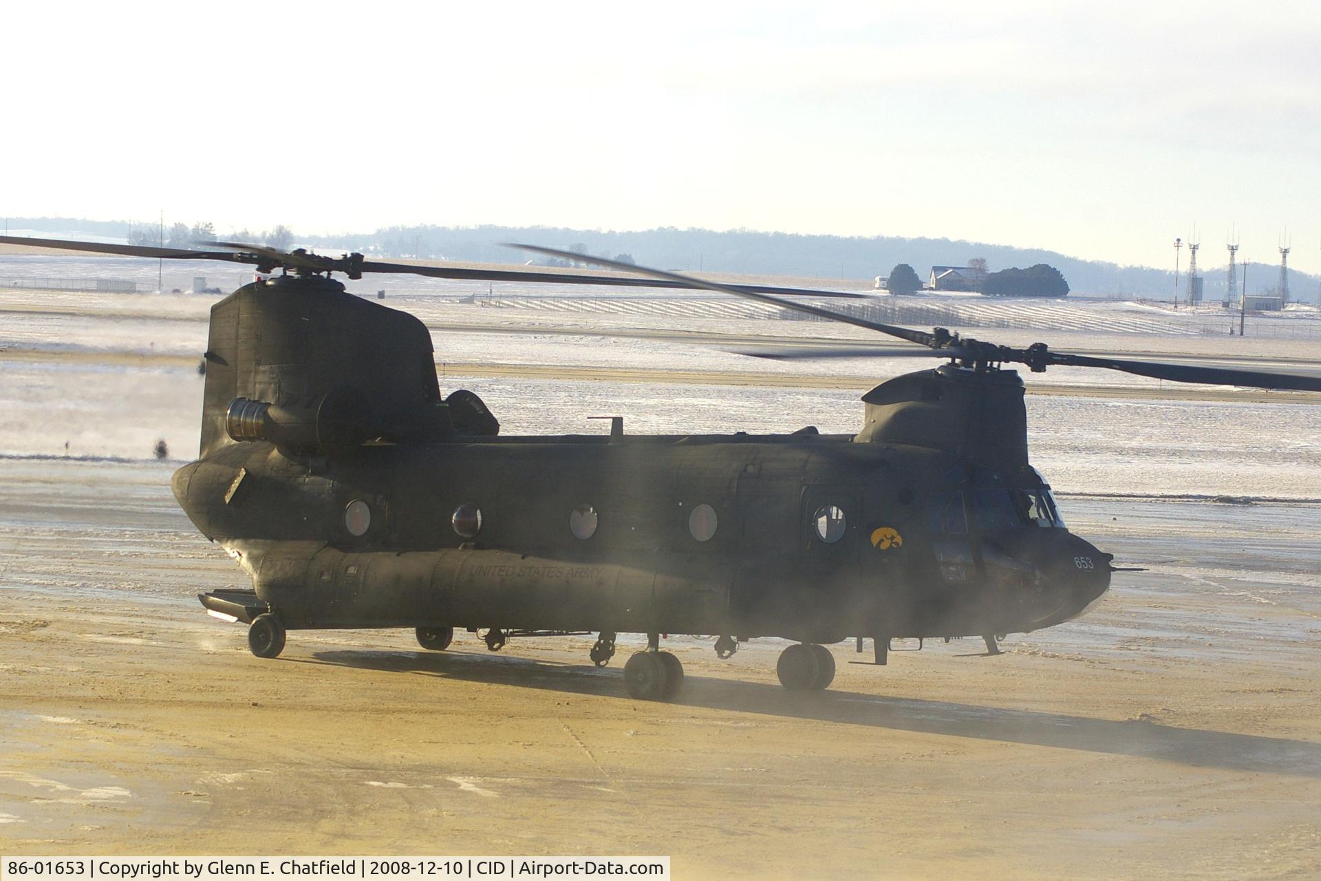 86-01653, 1986 Boeing CH-47D Chinook C/N M.3158, Taxiing past the tower to Landmark FBO. Blowing dust, blowing snow and glare on my window.