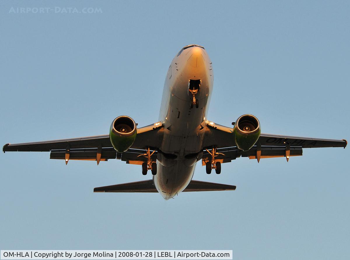 OM-HLA, 1987 Boeing 737-329 C/N 23773, On final to RWY 25R at dusk.