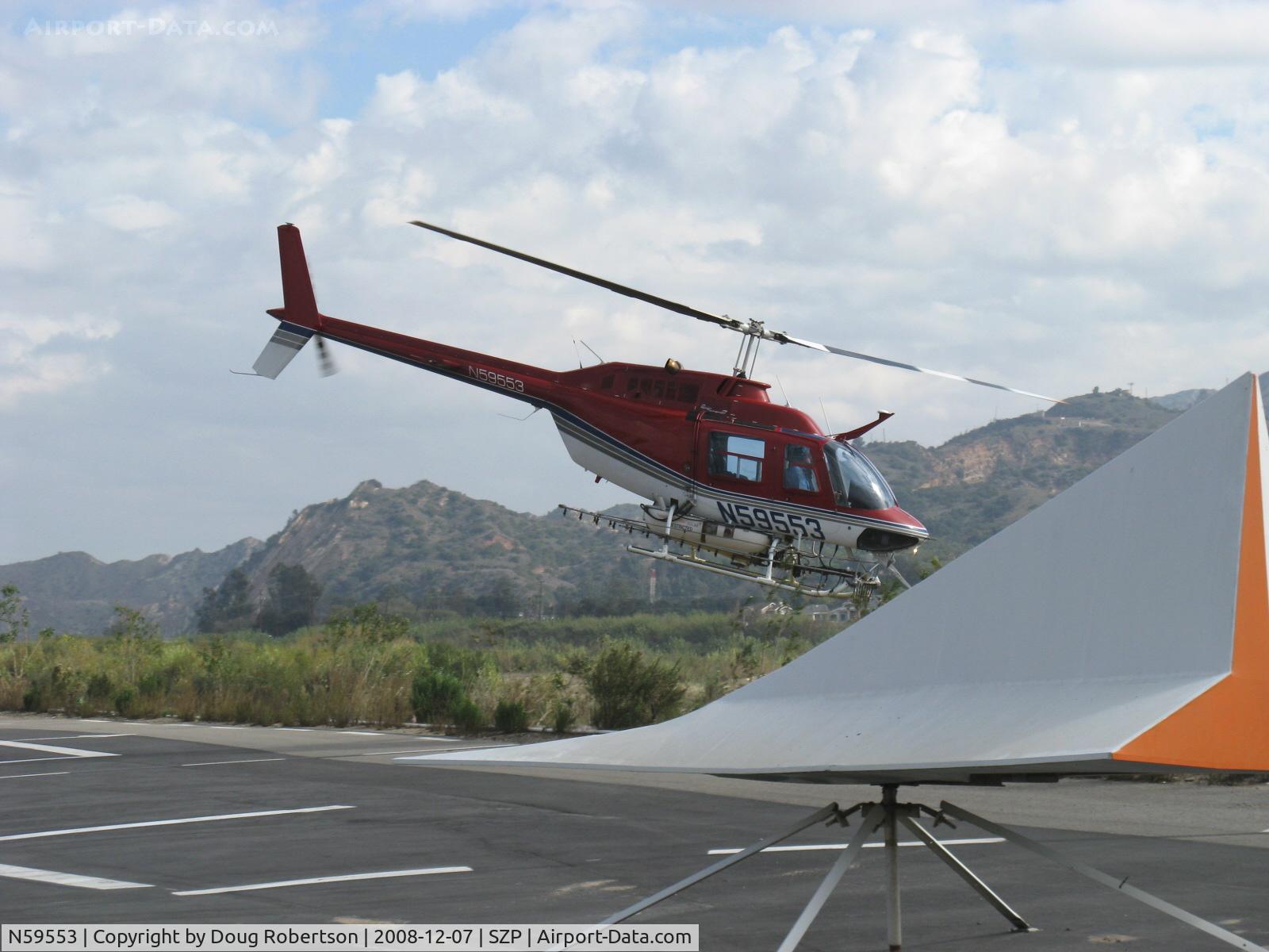 N59553, 1974 Bell 206B JetRanger C/N 1451, 1974 Bell 206B JETRANGER, Allison 250-C20 400 Hp turbine, liftoff past wind tee