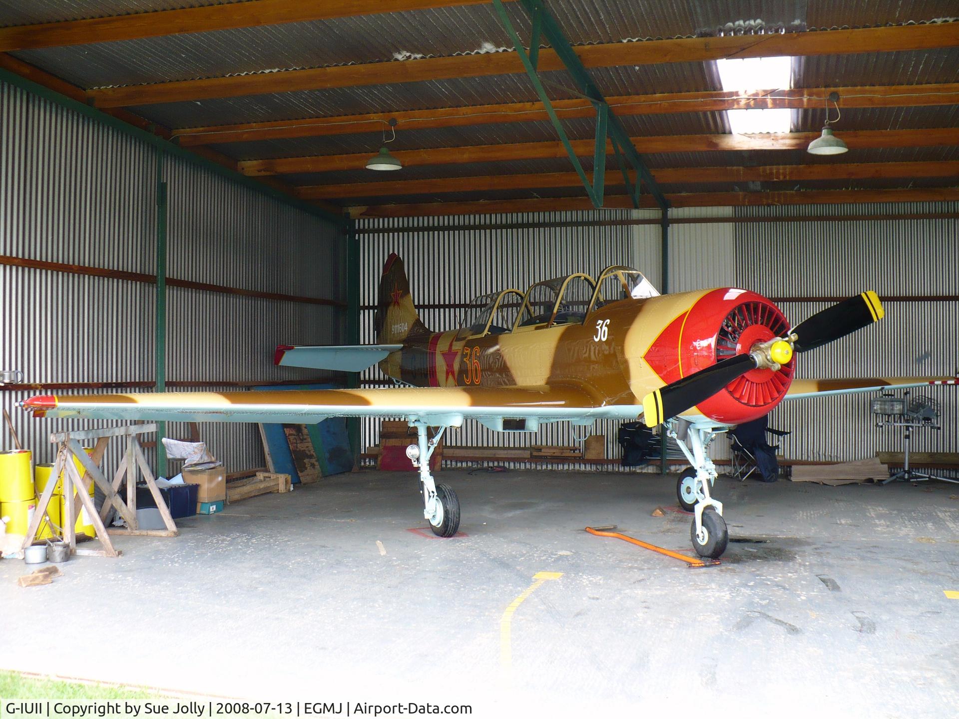 G-IUII, 1991 Yakovlev (Aerostar) Yak-52 C/N 9111604, In the hangar