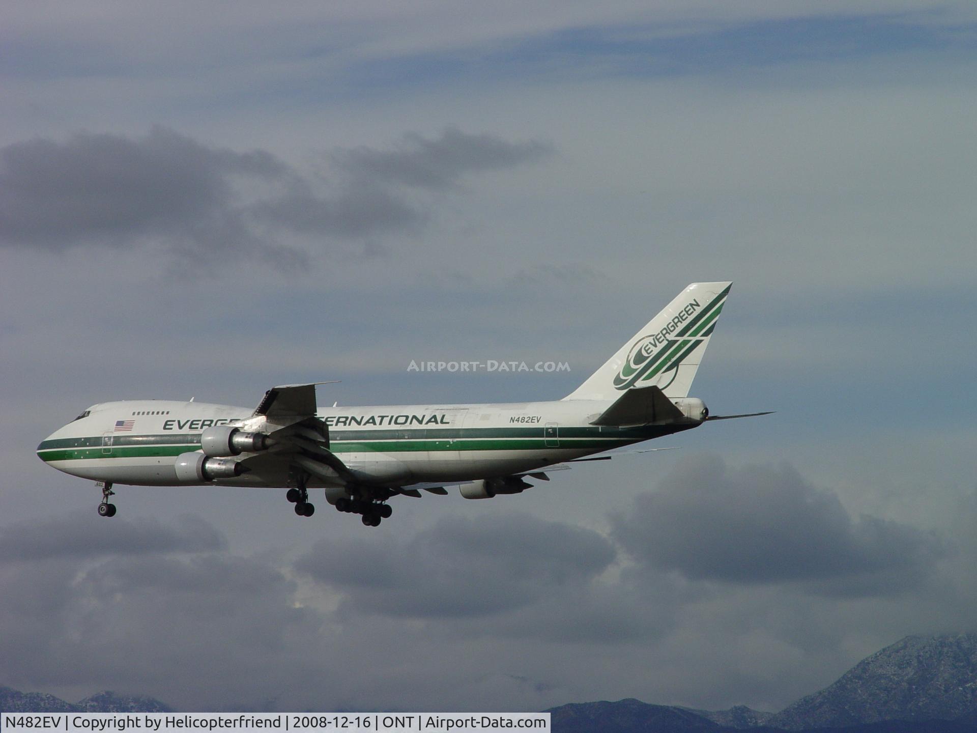 N482EV, 1973 Boeing 747-212B C/N 20713, Passing over outer fence at Ontario Airport