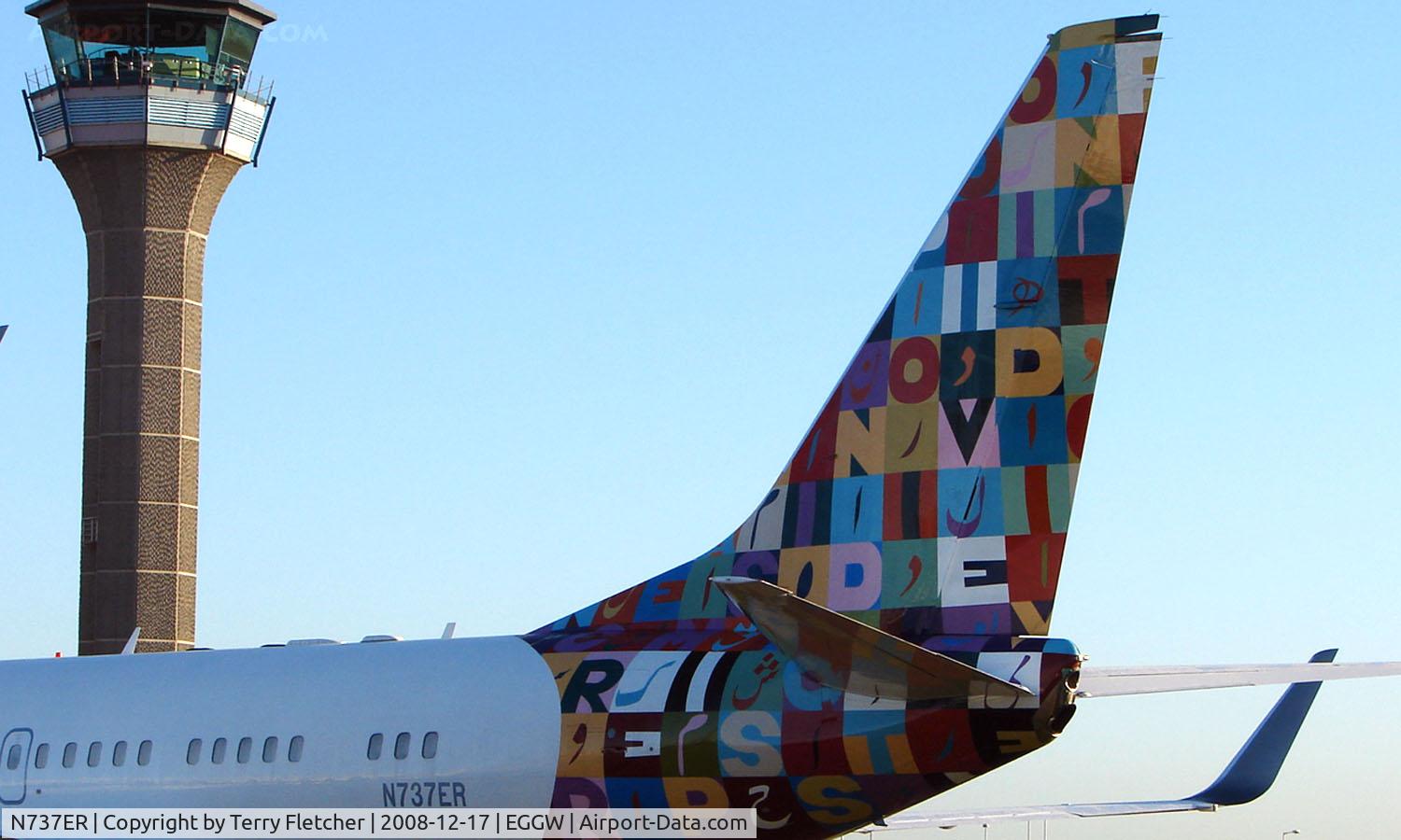 N737ER, 2000 Boeing 737-7CJ BBJ C/N 30754, This Executive Boeing 737 has each side of its tail , painted in different liveries  - Side 1 of 2