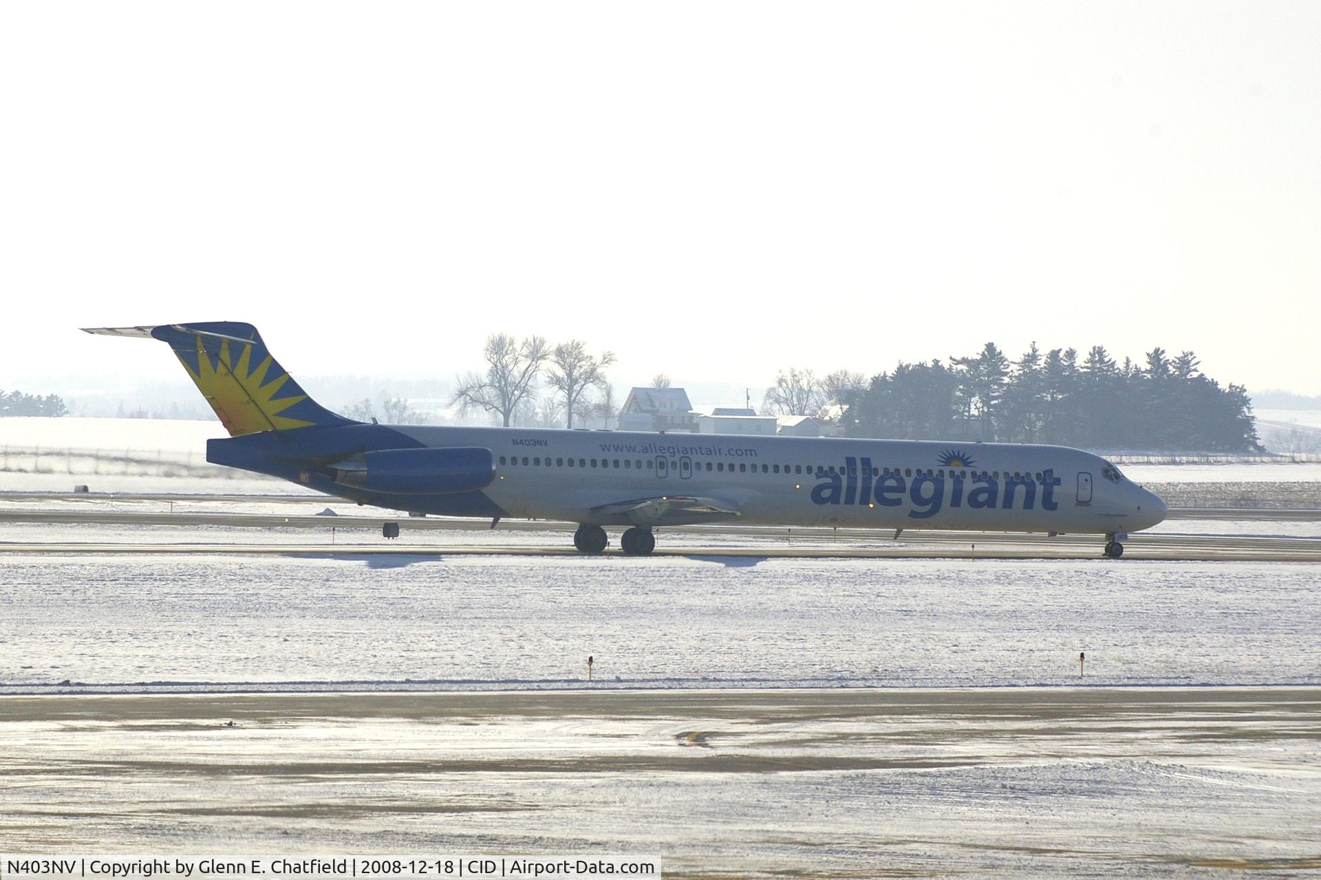 N403NV, 1989 McDonnell Douglas MD-88 C/N 49764, Taxiing to Runway 9.  I'm looking into the snow, haze and sun!