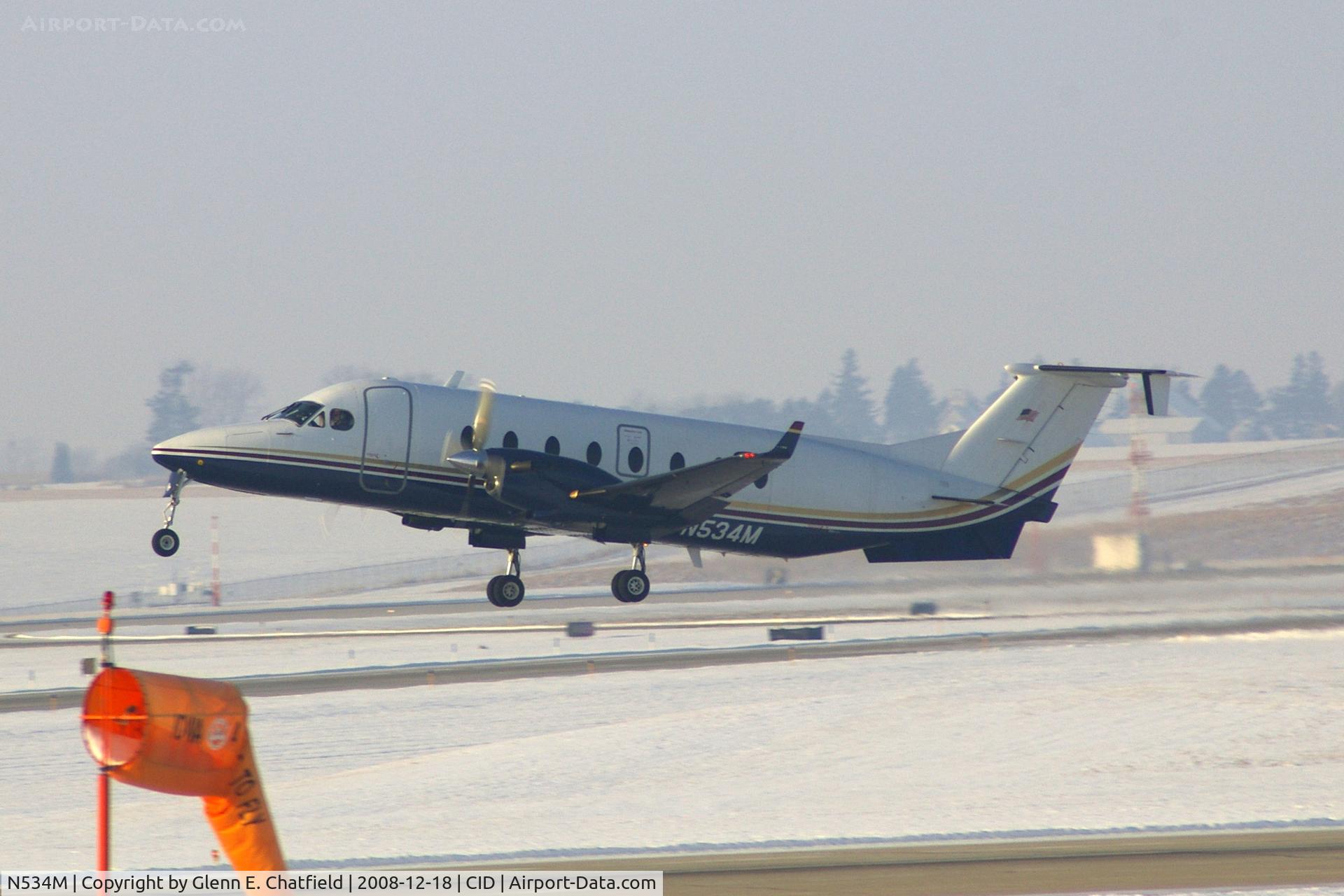 N534M, 1998 Raytheon 1900D C/N UE-333, Departing runway 13, as seen from my office in the tower.