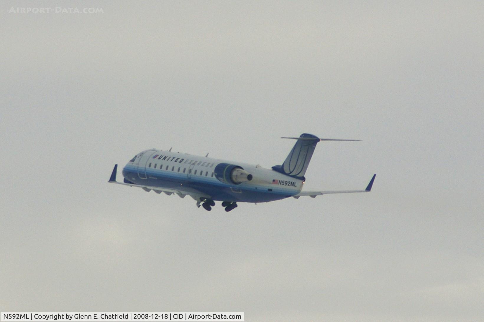 N592ML, 2000 Bombardier CRJ-200ER (CL-600-2B19) C/N 7410, Landing gear coming up.  On the way to O'Hare International