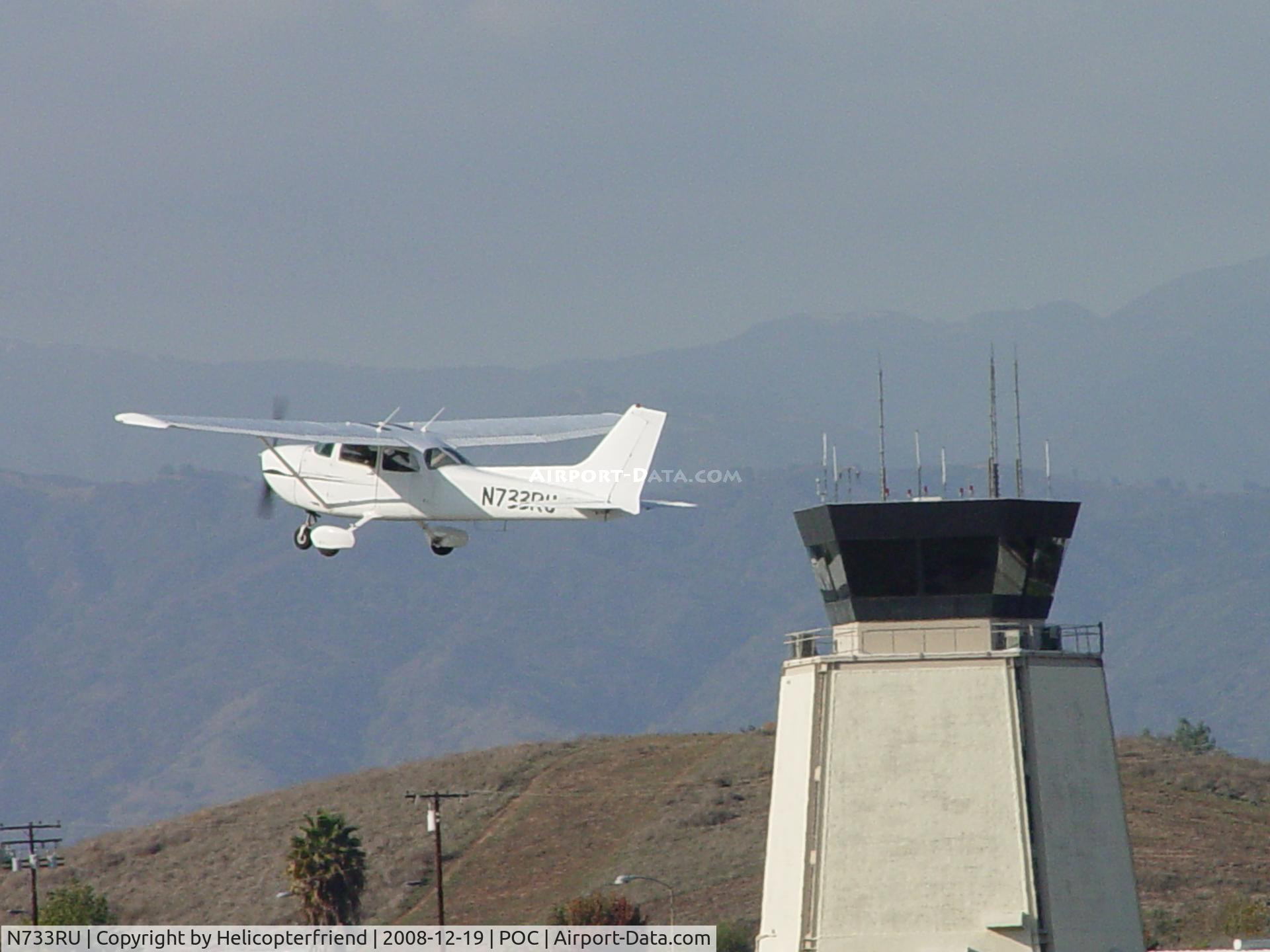 N733RU, 1977 Cessna 172N C/N 17268497, In the air passing Brackett Tower