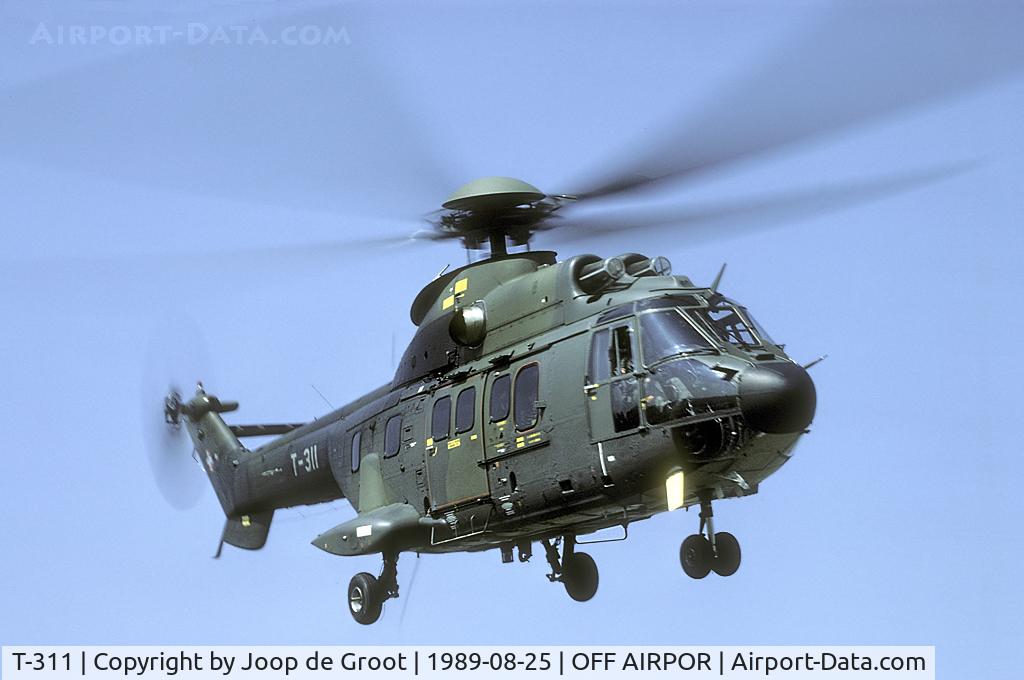 T-311, 1987 Aerospatiale TH89 Super Puma (AS-332M1) C/N 2216, This Super Puma transported us into the field somewhere south of Zürich. Here the Swiss had constructed a make shift bombing range.