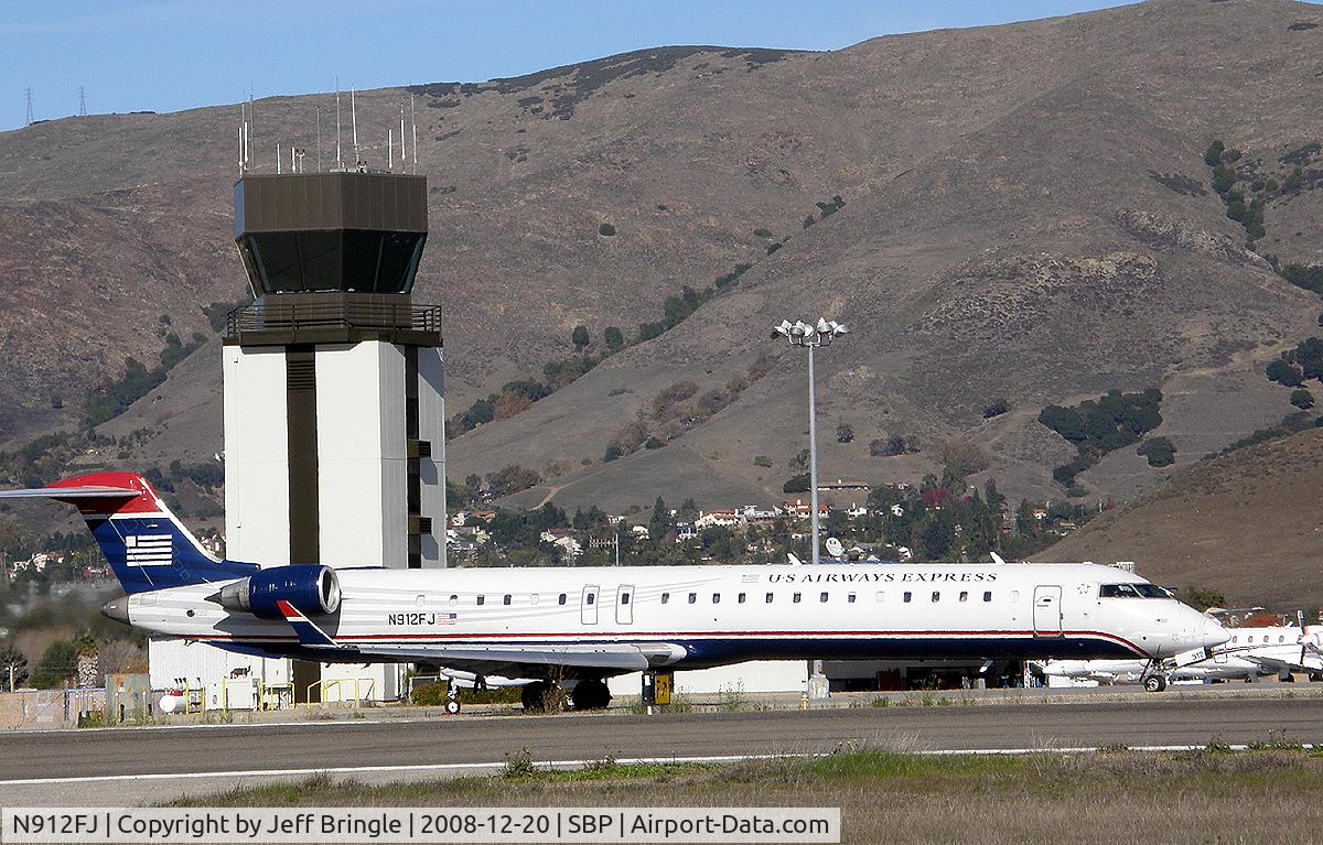 N912FJ, 2004 Bombardier CRJ-900ER (CL-600-2D24) C/N 15012, afternoon taxi past control tower
