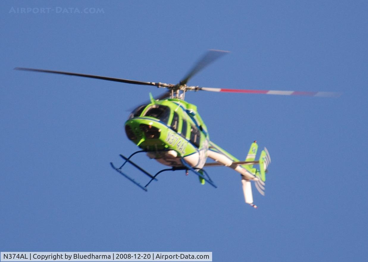 N374AL, 2008 Bell 407 C/N 53819, AirLife Denver heading West over Columbine High School Littleton, Colorado.