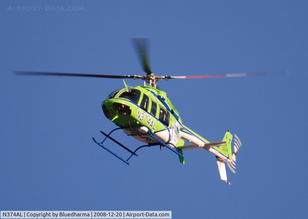 N374AL, 2008 Bell 407 C/N 53819, AirLife Denver heading West over Columbine High School Littleton, Colorado.