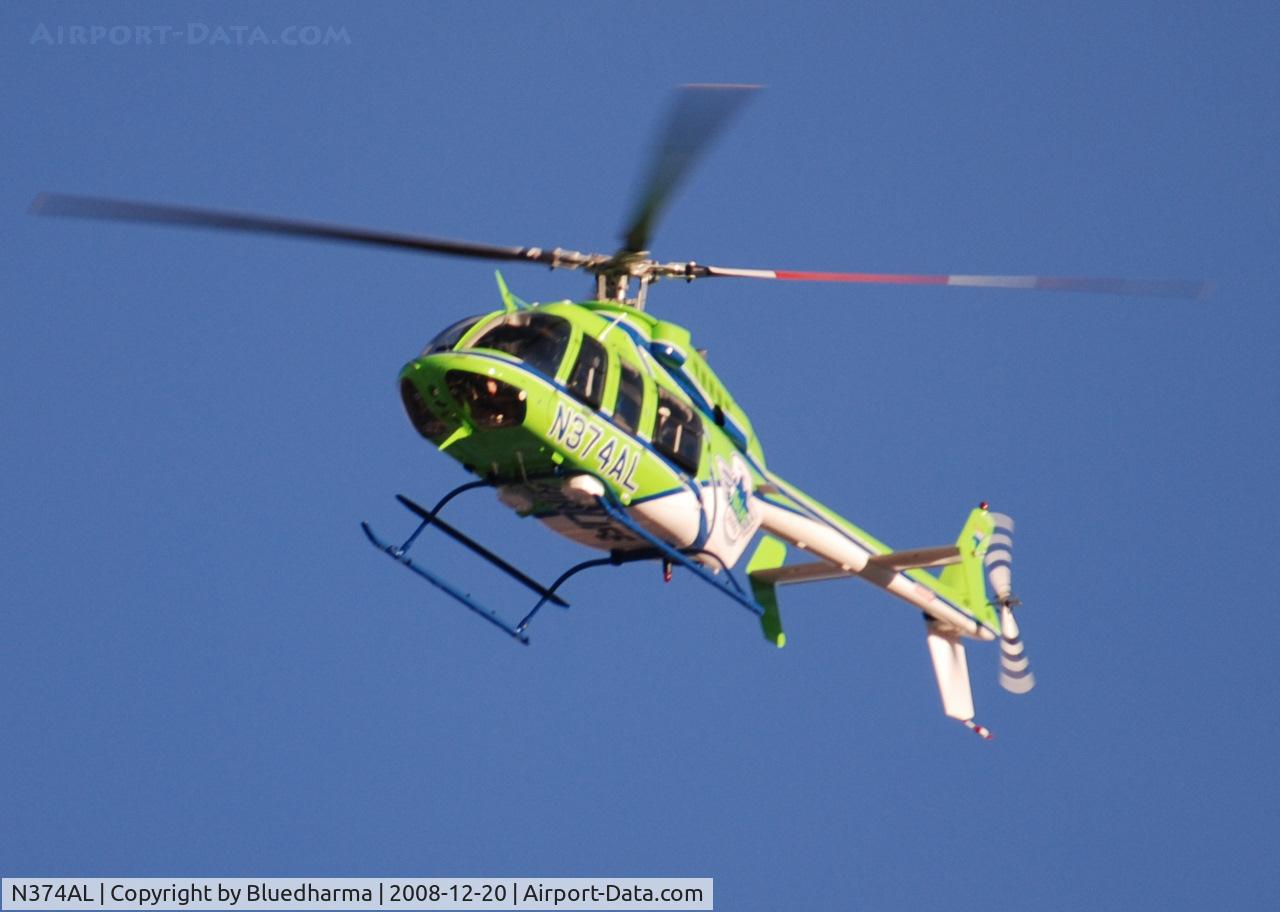 N374AL, 2008 Bell 407 C/N 53819, AirLife Denver heading West over Columbine High School Littleton, Colorado.