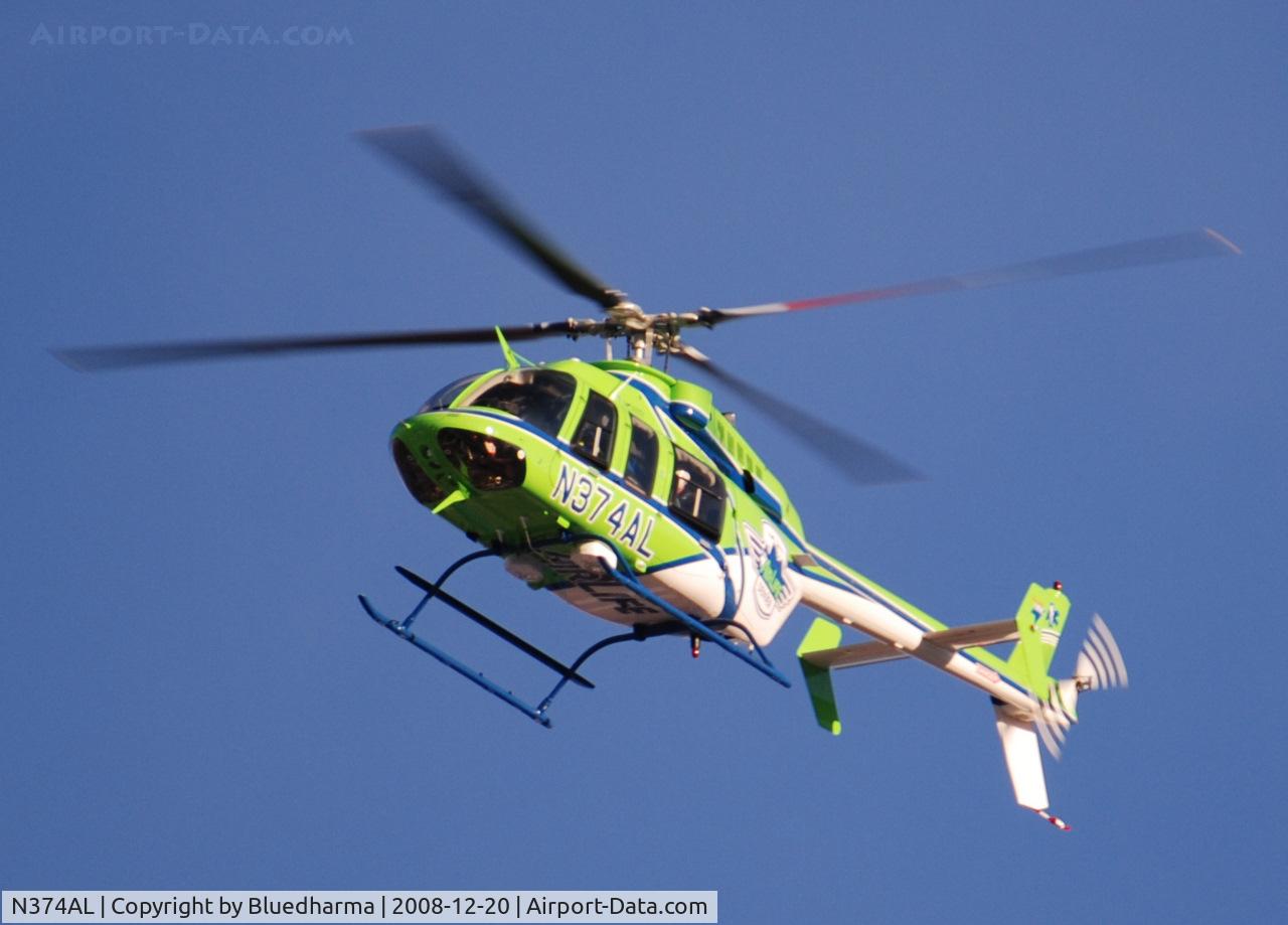N374AL, 2008 Bell 407 C/N 53819, AirLife Denver heading West over Columbine High School Littleton, Colorado.
